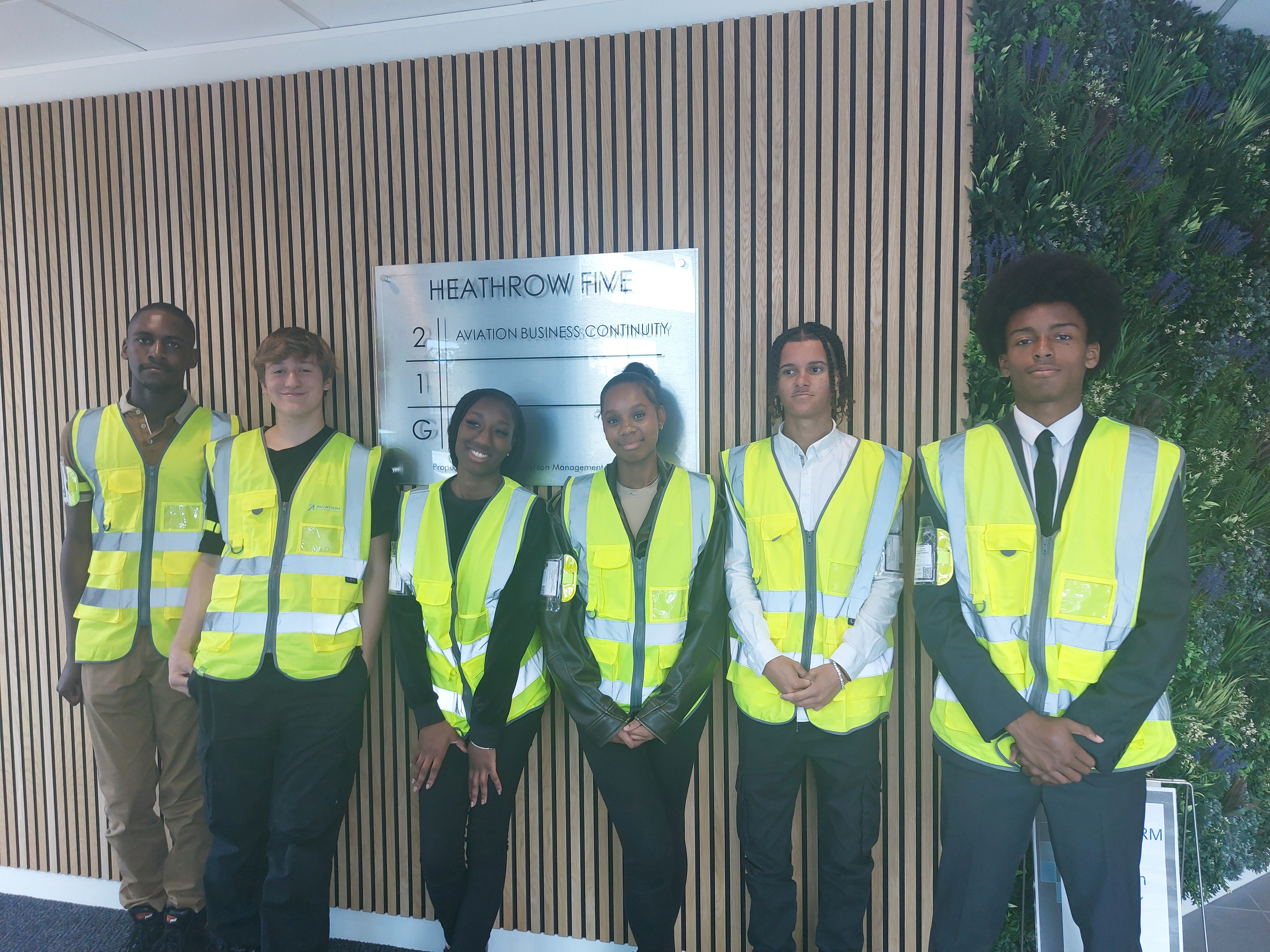 Youth in High vis jackets at Heathrow