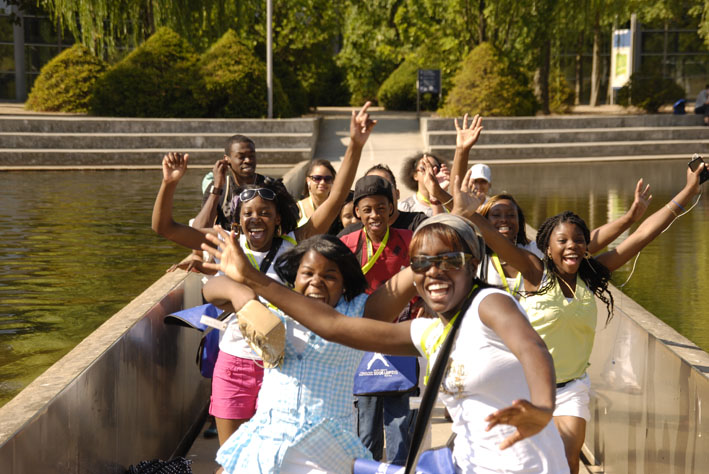 Young People smiling running with hands up